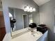 Bathroom features a large vanity mirror and sink at 1901 Griff Wood Ct, Saint Cloud, FL 34772