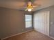 Bright bedroom with ceiling fan and window at 1901 Griff Wood Ct, Saint Cloud, FL 34772