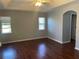 Large bedroom with wood-look floors and ample natural light at 1901 Griff Wood Ct, Saint Cloud, FL 34772