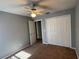 Bright bedroom with ceiling fan and double-door closet at 1901 Griff Wood Ct, Saint Cloud, FL 34772