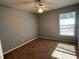 Well-lit bedroom with ceiling fan and large window at 1901 Griff Wood Ct, Saint Cloud, FL 34772