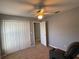 Spacious bedroom with ceiling fan and double-door closet at 1901 Griff Wood Ct, Saint Cloud, FL 34772