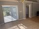 Dining area with tiled floor and sliding glass door to patio at 1901 Griff Wood Ct, Saint Cloud, FL 34772