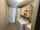 Laundry room with washer, dryer, and overhead storage at 1901 Griff Wood Ct, Saint Cloud, FL 34772