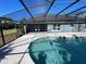 Inviting pool area with screened enclosure and spacious patio at 1901 Griff Wood Ct, Saint Cloud, FL 34772