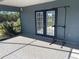 Screened porch with tile floor and pull-up bar at 1901 Griff Wood Ct, Saint Cloud, FL 34772