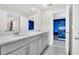 Double vanity bathroom with gray cabinets and white countertop at 1919 Tropical Palms Cir, Kissimmee, FL 34747