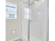 Bathroom with shower and window at 1919 Tropical Palms Cir, Kissimmee, FL 34747