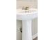 Classic pedestal sink with chrome fixtures at 1919 Tropical Palms Cir, Kissimmee, FL 34747