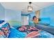 Bedroom with Moana-themed bedding and mural at 1919 Tropical Palms Cir, Kissimmee, FL 34747