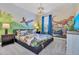 Dinosaur-themed bedroom with mural, TV and comfortable bed at 1919 Tropical Palms Cir, Kissimmee, FL 34747