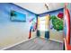 Superhero-themed bedroom with mural and flat-screen TV at 1919 Tropical Palms Cir, Kissimmee, FL 34747