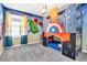 Superhero-themed bedroom with bunk bed and mural at 1919 Tropical Palms Cir, Kissimmee, FL 34747