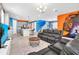 Open living area with Star Wars mural and sectional at 1919 Tropical Palms Cir, Kissimmee, FL 34747