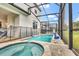 Private screened pool and hot tub with paver deck at 1919 Tropical Palms Cir, Kissimmee, FL 34747