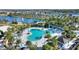 Expansive resort-style pool with numerous lounge chairs and umbrellas at 1919 Tropical Palms Cir, Kissimmee, FL 34747