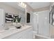 Modern bathroom with double vanity and a large walk-in shower at 1997 Tohoqua Blvd, Kissimmee, FL 34744