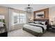 Bright bedroom with a king-size bed, large window, and wood accent wall at 1997 Tohoqua Blvd, Kissimmee, FL 34744