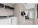 Laundry room with washer, dryer, and ample storage at 1997 Tohoqua Blvd, Kissimmee, FL 34744