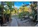 Landscaped backyard with walkway and tropical plants at 200 Maitland Ave # 37, Altamonte Springs, FL 32701