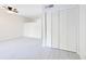 Living room with ceiling fan and white bipass closet doors at 200 Maitland Ave # 37, Altamonte Springs, FL 32701