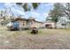 Blue house with a spacious backyard and boat at 23627 Franklin Ave, Sorrento, FL 32776