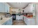 Cozy kitchen with white cabinets and ample counter space at 23627 Franklin Ave, Sorrento, FL 32776