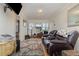 Cozy living room featuring leather recliners and a fireplace at 23627 Franklin Ave, Sorrento, FL 32776