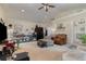 Vaulted ceiling living room with a lot of natural light at 23627 Franklin Ave, Sorrento, FL 32776