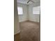 Bright bedroom with carpet and two windows at 2575 Edmond Cir, Auburndale, FL 33823