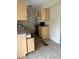 Kitchen with wood cabinets and linoleum floor at 2575 Edmond Cir, Auburndale, FL 33823