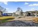 Aerial view showcasing home's exterior and deck at 28 Da Rosa Ave, Debary, FL 32713