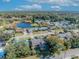 Aerial showing neighborhood homes near a lake, one with a pool at 3306 Florene Dr, Orlando, FL 32806