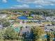 Aerial view of a home near a lake and its surrounding neighborhood at 3306 Florene Dr, Orlando, FL 32806