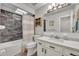 Bathroom with a tub shower combo, white vanity, and dark tile at 3306 Florene Dr, Orlando, FL 32806