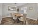 Bright dining room with a rustic wooden table and modern chairs at 3306 Florene Dr, Orlando, FL 32806