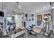 Bright home gym with various workout equipment and access to other rooms at 3306 Florene Dr, Orlando, FL 32806