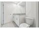 Bathroom with granite countertop, white cabinets, and toilet at 3326 Thicket St, Tavares, FL 32778