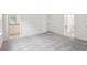 Spacious bedroom with grey carpet and access to the bathroom at 3326 Thicket St, Tavares, FL 32778