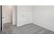 Grey carpeted bedroom with closet and access to hallway at 3326 Thicket St, Tavares, FL 32778