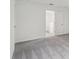 Bright bedroom with grey carpet and access to a loft area at 3326 Thicket St, Tavares, FL 32778