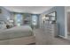 Main bedroom with light gray walls and neutral bedding at 3326 Thicket St, Tavares, FL 32778