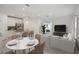 Kitchen and dining area with white cabinets and a round dining table at 3326 Thicket St, Tavares, FL 32778