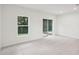 Bright Gathering room with sliding glass doors leading to the backyard at 3326 Thicket St, Tavares, FL 32778