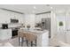 Modern kitchen with white cabinets, granite island, and stainless steel appliances at 3326 Thicket St, Tavares, FL 32778