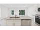 Kitchen island with double sink and granite countertop at 3326 Thicket St, Tavares, FL 32778