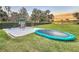 Serene backyard with playground, trampoline, and sunset views at 3415 S Mellonville Ave, Sanford, FL 32773