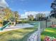 Large backyard with playground, trampoline, and lake views at 3415 S Mellonville Ave, Sanford, FL 32773