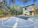 Expansive outdoor basketball court next to house at 3415 S Mellonville Ave, Sanford, FL 32773