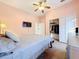 Peaceful bedroom with a queen-size bed and built-in closet at 3415 S Mellonville Ave, Sanford, FL 32773